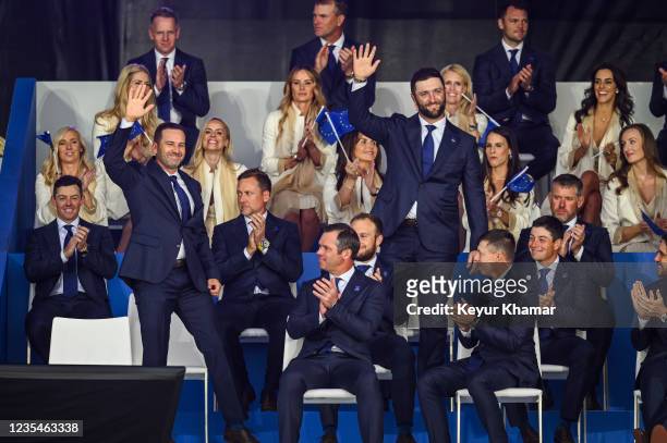 Team Europe players Sergio Garcia of Spain and Jon Rahm of Spain smile and wave as they are announced as a Friday Foursomes pairing during the...