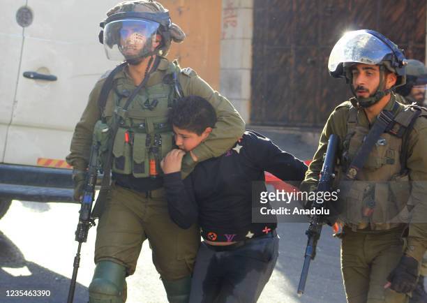 Israeli soldiers detain a 10-year-old Palestinian boy Ismail en-Nicce in Hebron, West Bank on September 23, 2021. Ismail en-Nicce was brutally...