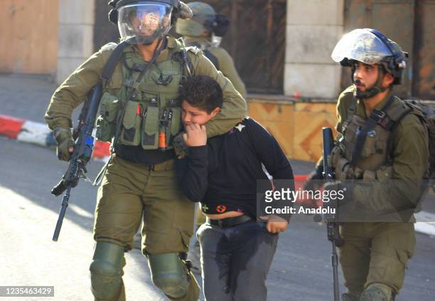 Israeli soldiers detain a 10-year-old Palestinian boy Ismail en-Nicce in Hebron, West Bank on September 23, 2021. Ismail en-Nicce was brutally...