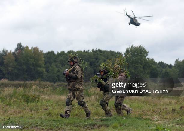 Ukrainian servicemen take part in the joint Rapid Trident military exercises with the United States and other NATO countries nor far from Lviv on...
