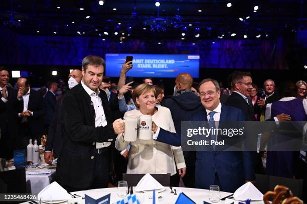 Christian Social Union chairman Markus Soeder, German Chancellor Angela Merkel and Christian Democratic Union party chairman and top candidate for...