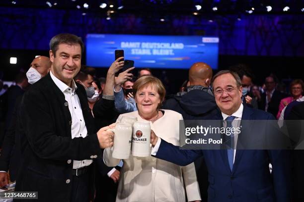 Christian Social Union chairman Markus Soeder, German Chancellor Angela Merkel and Christian Democratic Union party chairman and top candidate for...