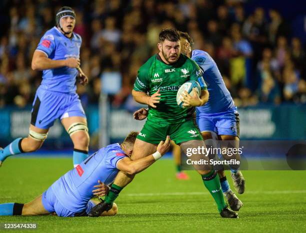 Wales , United Kingdom - 24 September 2021; Matthew Burke of Connacht is tackled by Jason Harries, left, and Willis Halaholo of Cardiff Blues during...