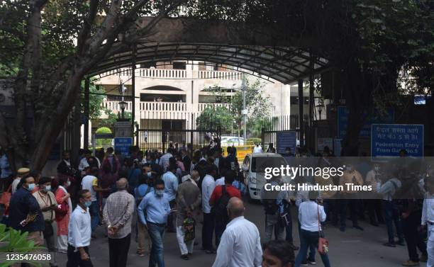 Members of the media gather outside the to the Rohini district court on September 24, 2021 in New Delhi, India. Earlier in the day, gangster Jitender...