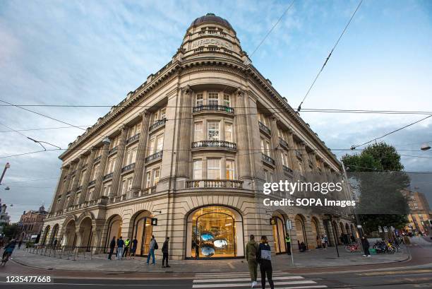 Early morning shoppers at Apples premier shop in Amsterdam, arrive early prior to the stores opening, to place their orders for Apples new iPhone 13...
