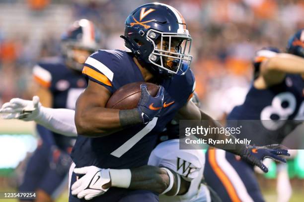 Mike Hollins of the Virginia Cavaliers returns a kickoff in the first half during against the Wake Forest Demon Deacons a game at Scott Stadium on...