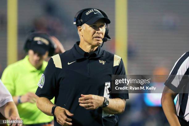 Head coach Dave Clawson of the Wake Forest Demon Deacons walks the sideline in the second half during a game against the Virginia Cavaliers at Scott...