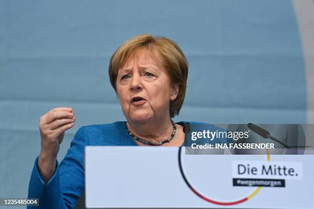 German Chancellor Angela Merkel gestures as she speaks on the podium during a campaign rally for Christian Democratic Union CDU leader and chancellor...