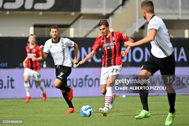 Milan's Italian forward Daniel Maldini controls the ball during the Italian Serie A football match between Spezia and AC Milan on September 25, 2021...