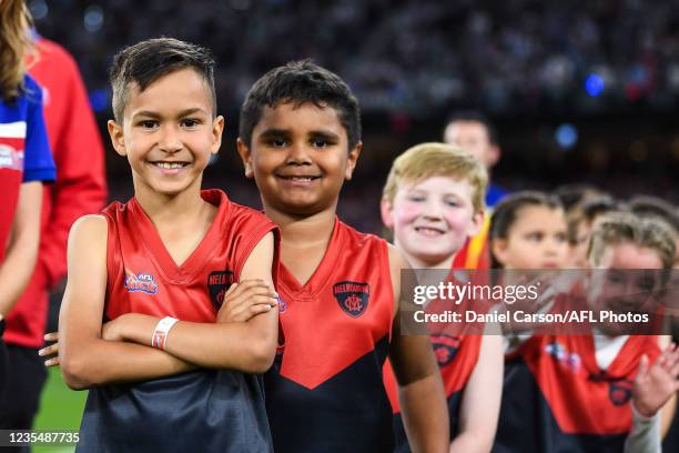 Auskick kids set themselves to present the Premiership medals during the 2021 Toyota AFL Grand Final match between the Melbourne Demons and the...