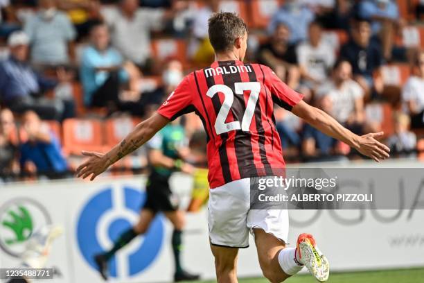 Milan's Italian forward Daniel Maldini celebrates after opening the scoring during the Italian Serie A football match between Spezia and AC Milan on...