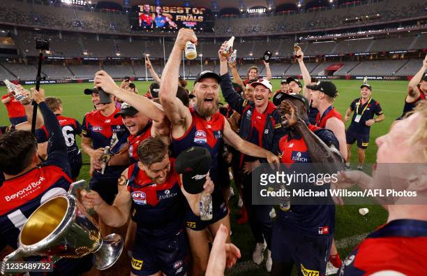 The Melbourne Demons team celebrate their victory with the Premiership Cup after the 2021 Toyota AFL Grand Final match between the Melbourne Demons...