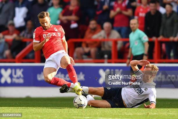 Maikel Kieftenbeld of Millwall fouls Philip Zinkernagel of Nottingham Forest during the Sky Bet Championship match between Nottingham Forest and...