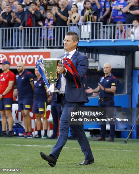 Glen Jackovich arrives with the Premiership Cup during the 2021 Toyota AFL Grand Final match between the Melbourne Demons and the Western Bulldogs at...