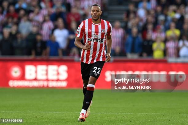 Brentford's Danish defender Mathias Jorgensen runs on the pitch during the English Premier League football match between Brentford and Liverpool at...