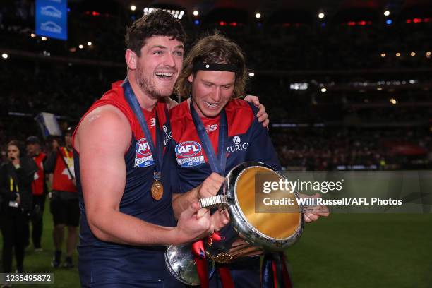 Angus Brayshaw of the Demons and Ed Langdon of the Demons celebrate with the 2021 Premiership cup during the 2021 Toyota AFL Grand Final match...