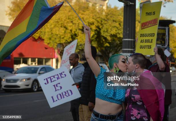 Members of local LGBTQ2S+ supporters and allies gather at Pride Corner on Whyte Avenue and Gateway Boulevard in Edmonton to counter protesting street...