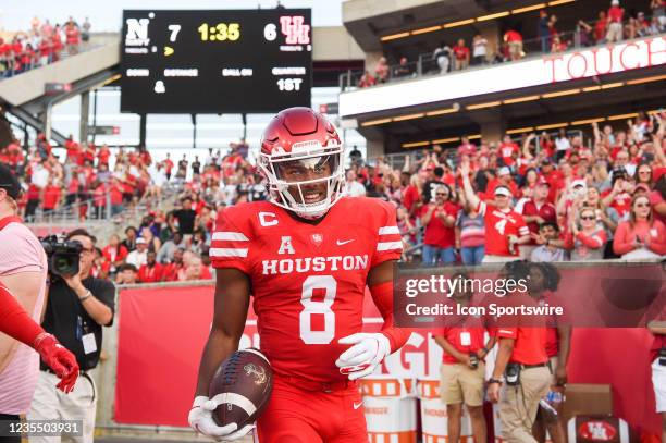 Houston Cougars cornerback Marcus Jones celebrates a first half punt return for a Cougar touchdown during the football game between the Navy...