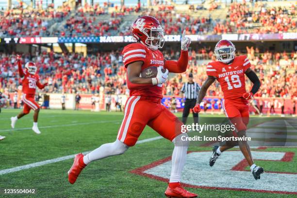 Houston Cougars cornerback Marcus Jones scores a first half touchdown on a long punt return during the football game between the Navy Midshipmen and...