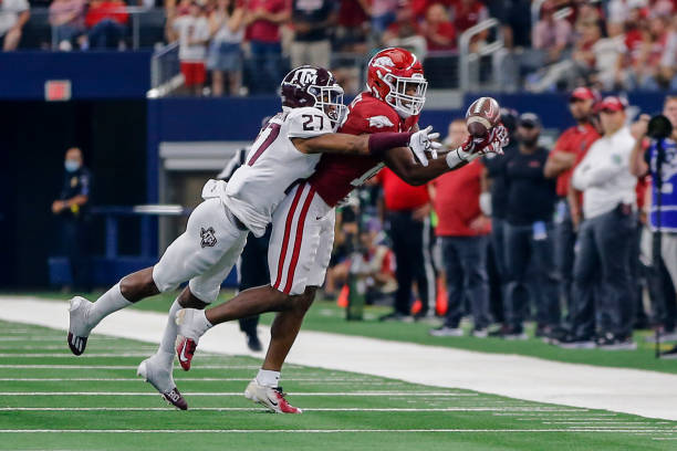 Arkansas Razorbacks wide receiver Tyson Morris catches a pass as Texas A&M Aggies defensive back Antonio Johnson tries to defend