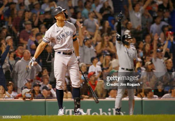 Giancarlo Stanton of the New York Yankees connects for a grand slam home run against the Boston Red Sox in the eighth inning at Fenway Park on...