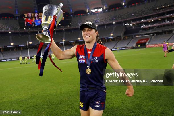 Tom Sparrow of the Demons celebrates with the premiership cup during the 2021 Toyota AFL Grand Final match between the Melbourne Demons and the...