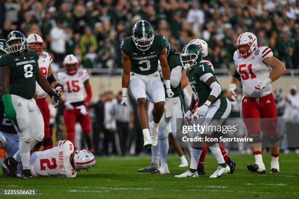 Michigan State Spartans safety Xavier Henderson celebrates a third down stop during a college football game between the Michigan State Spartans and...