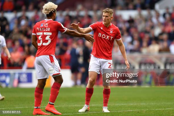 Lyle Taylor of Nottingham Forest and Ryan Yates of Nottingham Forest during the Sky Bet Championship match between Nottingham Forest and Millwall at...