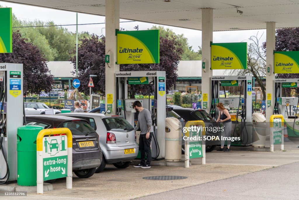 People filling their cars up at BP petrol station during the...