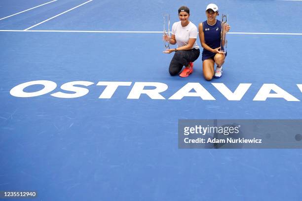 Winners Sania Mirza of India and Shuai Zhang of China pose with their trophies during the awarding ceremony following the Doubles Final on Day 7 of...