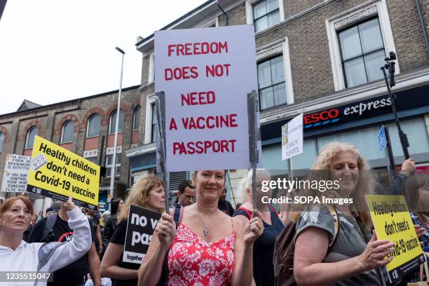 Protestor seen holding a placard saying 'Freedom does not need a vaccine passport' during the demonstration. The Anti-vaccine protest, led by...