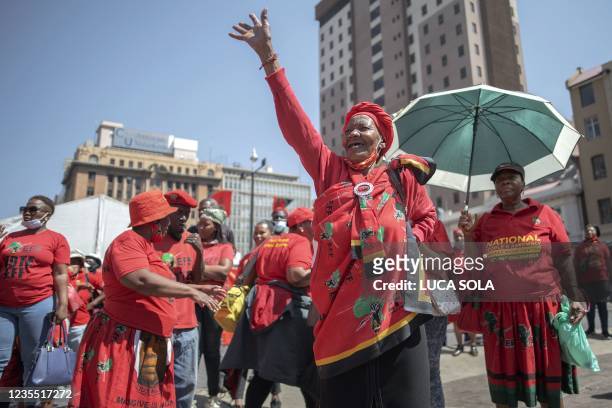 Supporters of the Economic Freedom Fighters sing and dance ahead of the party's manifesto launch for the upcoming local government elections in...