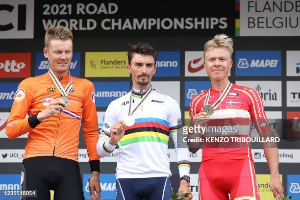 Gold medallist France's Julian Alaphilippe , wearing his World champion's rainbow jersey, silver medallist Netherlands' Dylan van Baarle and bronze...