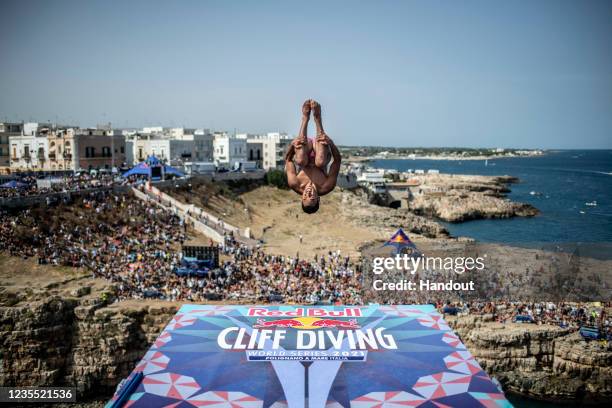 In this handout image provided by Red Bull, Sergio Guzman of Mexico dives from the 27.5 metre platform during the final competition day of the sixth...