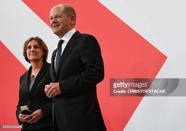 German Finance Minister, Vice-Chancellor and the Social Democrats candidate for Chancellor Olaf Scholz stands on stage with Minister of Education of...