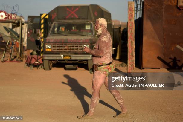 Man walks around during Wasteland Weekend Festival at the Mojave desert in Edwards, California on September 25, 2021. - The organizers require all...