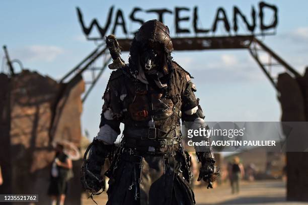 People attend Wasteland Weekend Festival at the Mojave desert in Edwards, California on September 25, 2021. - The organizers require all festival...