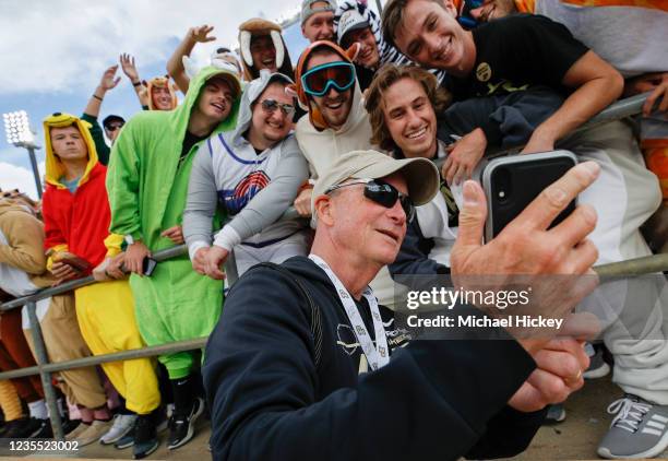 Mitch Daniels, Purdue University President greets students before the game against the Illinois Fighting Illini at Ross-Ade Stadium on September 25,...