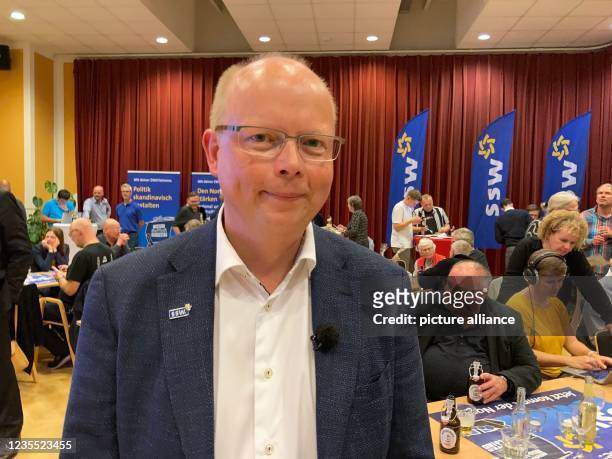 September 2021, Schleswig-Holstein, Flensburg: Stefan Seidler, top candidate of the Southern Schleswig Voters' Association , smiles into the camera...