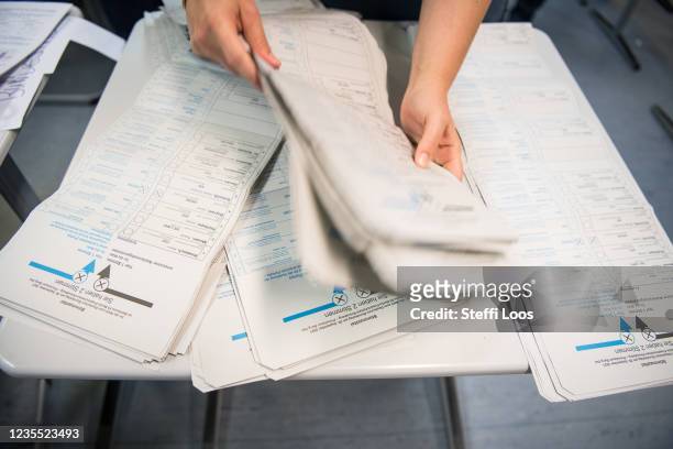 Volunteers count votes for the federal parliamentary elections on September 26, 2021 in Berlin, Germany. Voters were going to the polls nationwide...