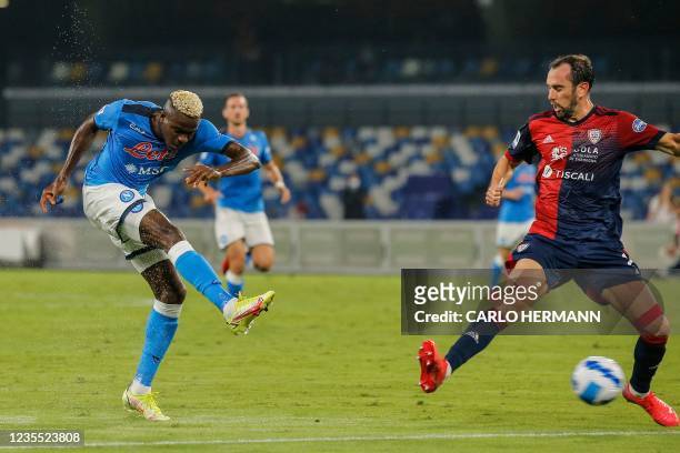 Napoli's Nigerian forward Victor Osimhen shoots onn target past Cagliari's Uruguayan defender Diego Godin during the Italian Serie A between Napoli...
