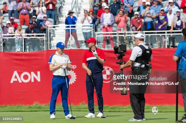 Matthew Fitzpatrick of England and team Europe and Daniel Berger of team United States on the first hole during the Singles Matches for the 2020...