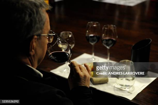 Tourist tastes wine at the Zuccardi Valle de Uco winery in Valle de Uco, San Carlos department, Mendoza province, Argentina, on September 26, 2021. -...