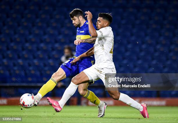 Nicolas Orsini of Boca Juniors kicks the ball to score the first goal of his team during a match between Boca Juniors and Colon as part of Torneo...