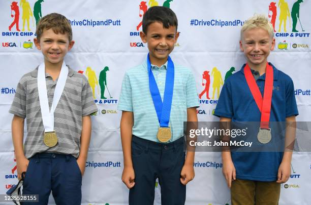 Lukas Kunrath won third, Carter Macy won first and Emery Johnson won third place in the boys 7-9 year old division of the 2021 Drive, Chip and Putt...