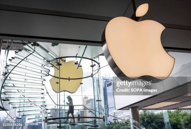 Customer is seen at the American multinational technology company Apple store and logo on the first weekend after the launch of the new iPhone 13...