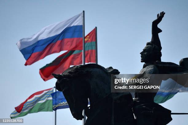 State flags of Russia and Transnistria fly in the wind close to the monument to the 18th century Russian military commander Alexander Suvorov in the...
