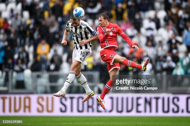Leonardo Bonucci of Juventus FC competes for a header with Mikkel Damsgaard of UC Sampdoria during the Serie A football match between Juventus FC and...