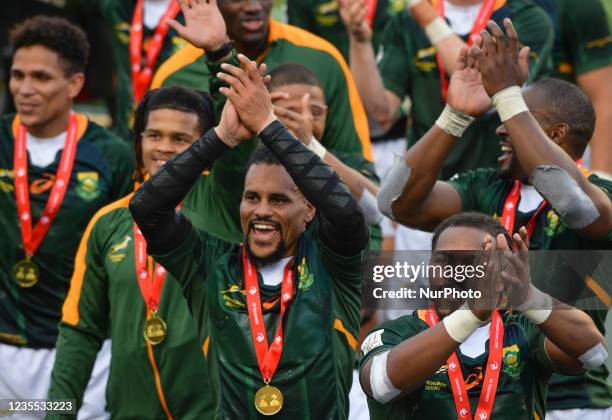 Members of the South African rugby sevens team celebrate at the Commonwealth Stadium in Edmonton after winning the HSBC World Rugby Seven Series...