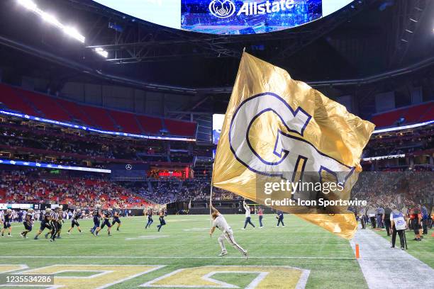 The Tech cheerleaders celebrate a touchdown during the Saturday evening college football game between the Georgia Tech Yellow Jackets and the UNC Tar...